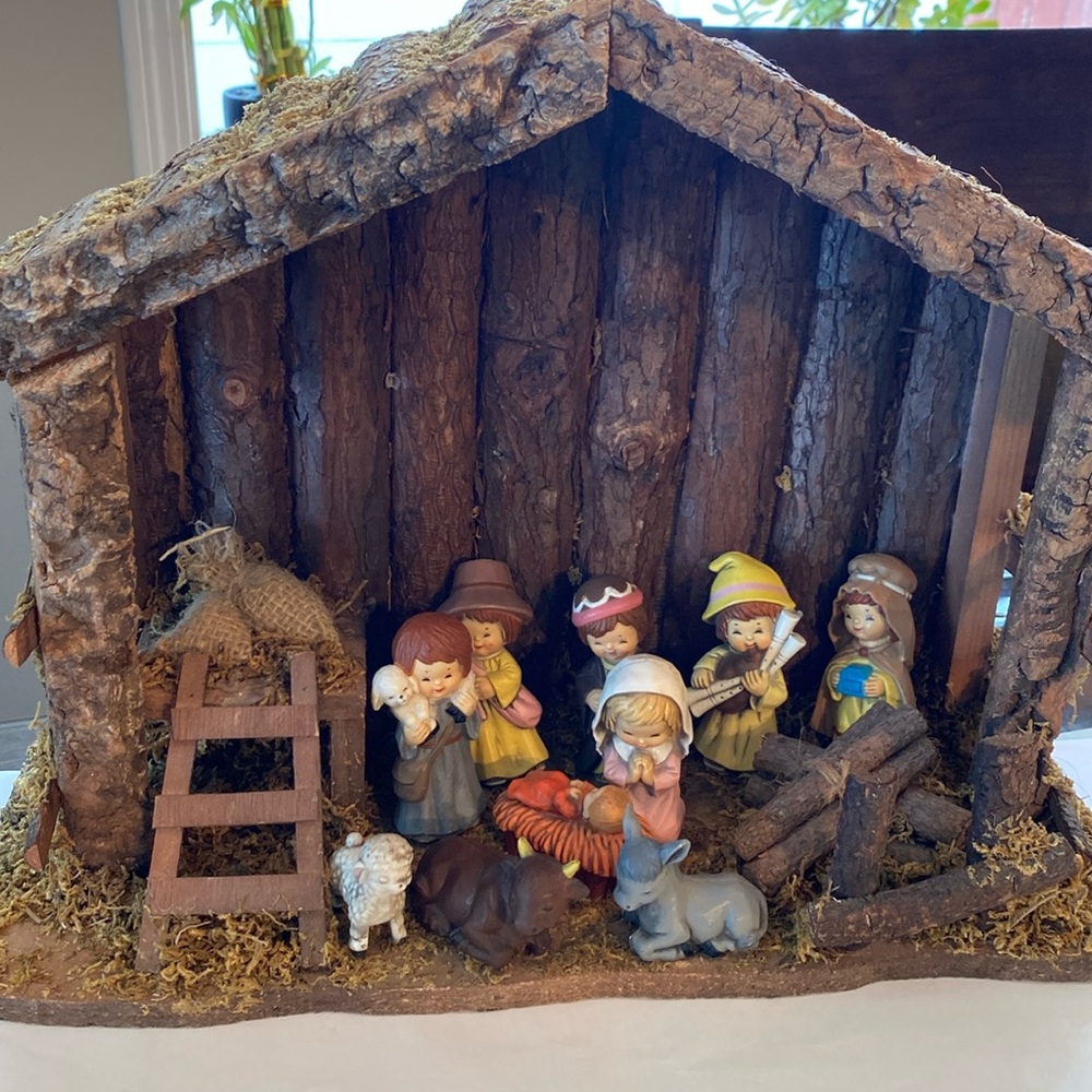 Wooden nativity scene, with plastic characters